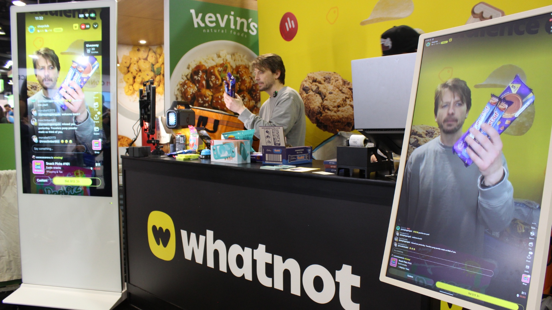 Live auction broadcast screens at the Whatnot booth