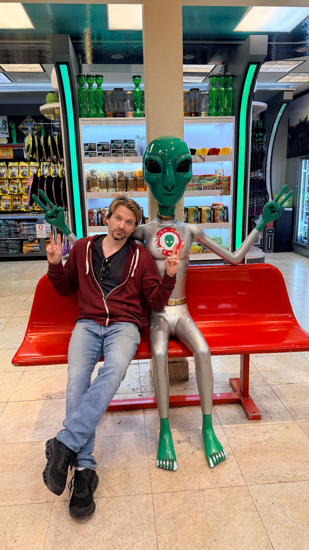 Co-founder posing with an alien at Alien Fresh Jerky
